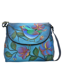 Load image into Gallery viewer, Anna by Anuschka style 8090, handpainted Large Flap Bag. Lonesome Bird Denim painting in blue color. Featuring flap opens with a magnetic snap closure to main compartment, Fits Laptop, Fits tablet, Fits E-Reader.
