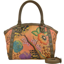 Load image into Gallery viewer, Anna by Anuschka style 8176, handpainted Large Studded Satchel. Floral Safari Brown painting in brown color. Featuring inside full length zippered pocket, two multipurpose pockets, Fits Laptop.
