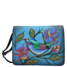 Load image into Gallery viewer, Anna by Anuschka style 8218, handpainted Small Flap Crossbody Organizer. Lonesome Bird Denim painting in blue color. Featuring one zippered and two open compartments, Built-in organizer, Fits E-Reader.
